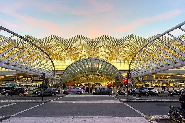 The glass and steel canopy of Gare do Oriente, designed by Santiago Calatrava, seen from outside at dusk