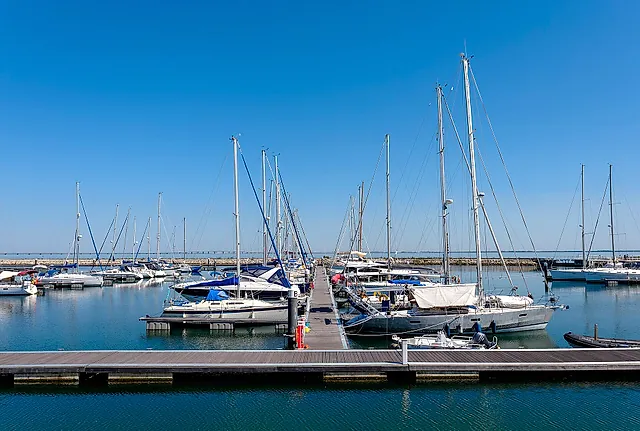 Sailboats moored in the marina at Parque das Nações under a clear sky